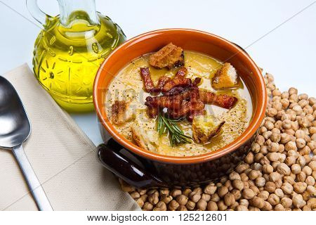 chickpeas soup on bowl with cheakpeas and oil