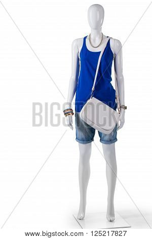 Tank top and white handbag. Female mannequin wearing white purse. Plain white leather bag. Affordable clothing at local shop.