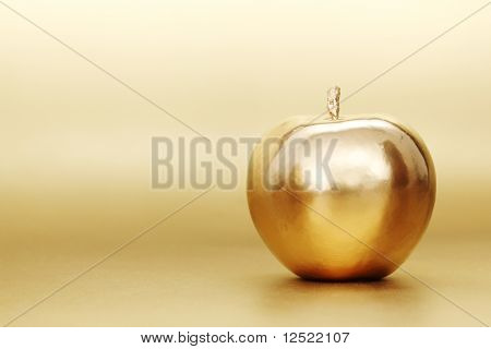guld apple på guld baggrund