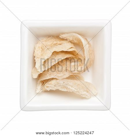 Pieces of bird's nest in a square bowl isolated on white background