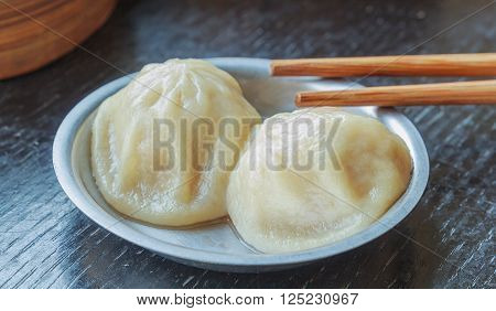 chinese dim sum on black table background