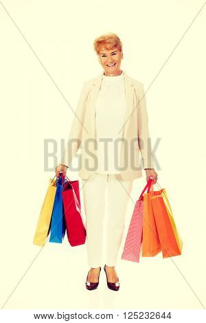 Happy business woman holging shopping bags