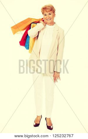 Happy business woman holging shopping bags
