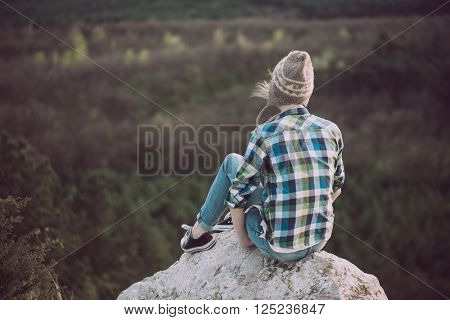 Young woman watching landscape, posing outdoor. Active lifestyle concept. 