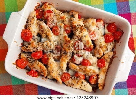 Italian chicken bake casserole with mozzarella cherry tomatoes and oregano