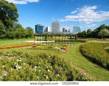 Office buildings in Danube City, Vienna, Austria. Beautiful garden and tree in foreground