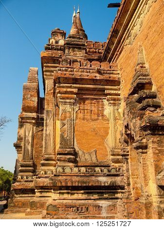 Outdoors view of Htilominlo Temple in Bagan, Myanmar. Vertical shot