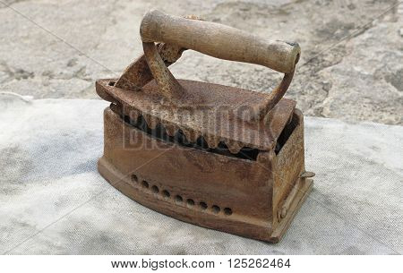 household rusty, metal old iron on a gray background
