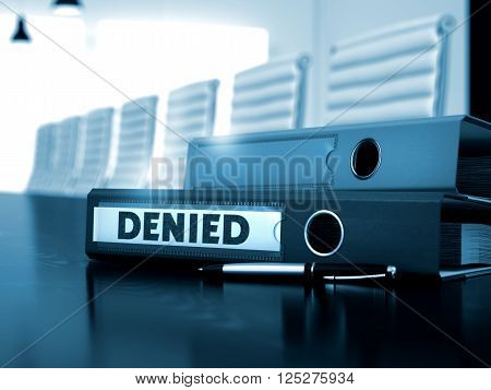 Denied - Business Concept on Toned Background. Denied. Illustration on Blurred Background. Denied - Ring Binder on Wooden Desk. Office Folder with Inscription Denied on Wooden Desktop. 3D Toned Image.