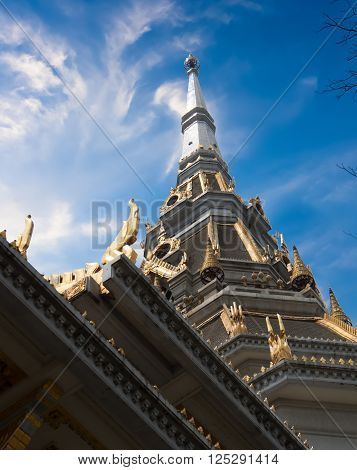 Thailand white church with blue sky and white clouds.