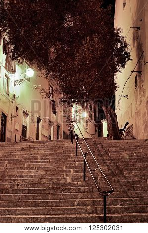 Alfama street at night in Lisbon Portugal