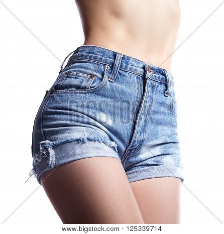 Sexy woman in fashion blue jeans shorts. Perfect hot booty and erotic curves hips. Good body shapes whithout cellulite. Sport and diet.