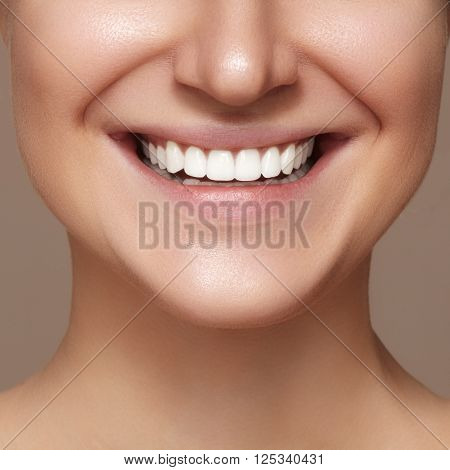 Beautiful smile with whitening teeth. Dental photo. Macro closeup of perfect female mouth, lipscare rutine