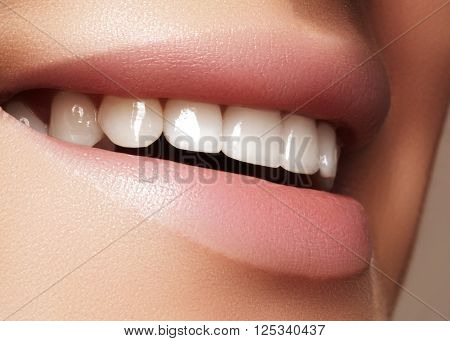 Beautiful smile with whitening teeth. Dental photo. Macro closeup of perfect female mouth, lipscare rutine