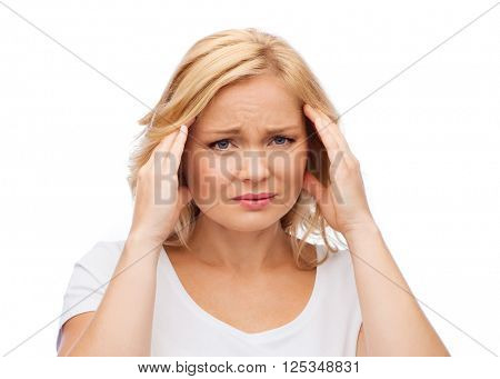 people, healthcare, stress and problem concept - unhappy woman suffering from headache