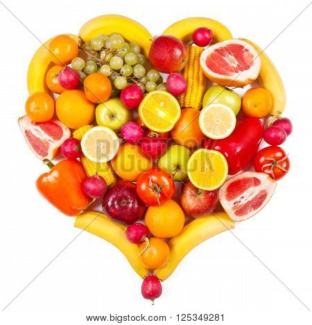 Colourful heart shaped fruit and vegetables composition isolated on white
