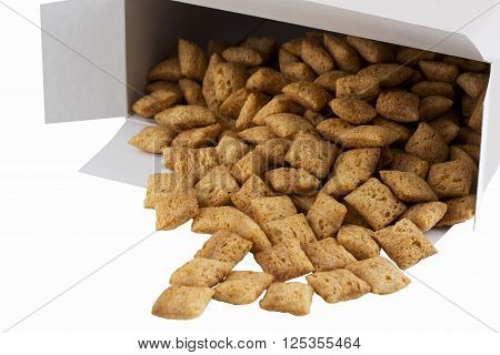 a handful of dry cereal in the shape of squares