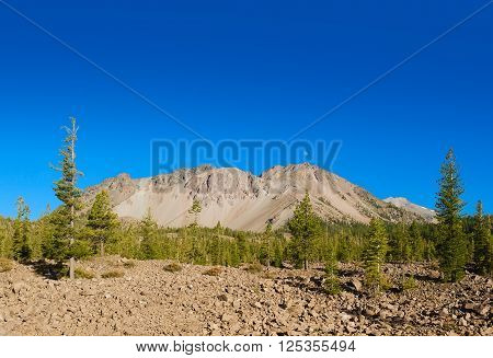 Mount Lassen with deposit of rocks ejected in the eruption. Mount Lassen is an active volcano in California.