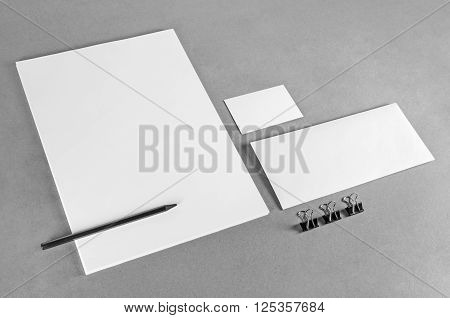 Blank stationery template on gray background. Photo of blank stationery set. Mock-up for branding identity. For design presentations and portfolios. Grayscale image.