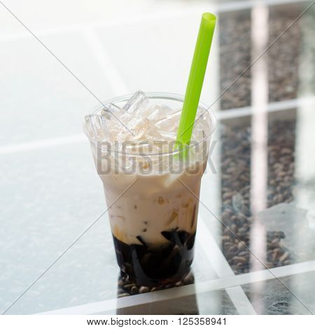Grass Jelly with milk and caramel in Plastic mug Thai dessert