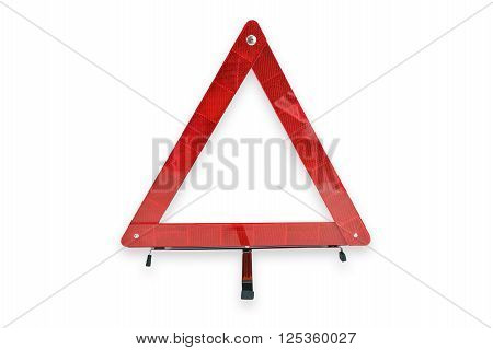 Red plastic warning triangle isolated against a white background