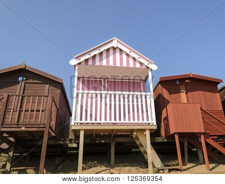 A pink beach hut by the coast, Frinton-on-sea Essex England UK.