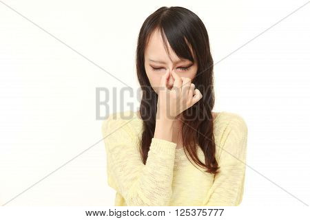 portrait of woman suffers from Asthenopia on white background