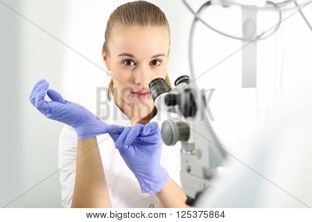 Eye clinic, ophthalmologist imposed on rubber gloves.