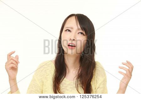 portrait of perplexed woman on white background