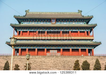 Beijing, China at the Zhengyangmen Gatehouse in Tiananmen Square. Beautiful historical building at sunset.