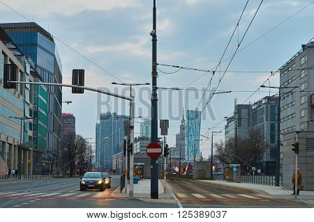 Warsaw, Poland - March 28, 2016: Kasprzaka street, Office building Warsaw Spire under construction in Warsaw, Poland. Warsaw Spire is a modern landmark and a powerful symbol of Warsaws energy.
