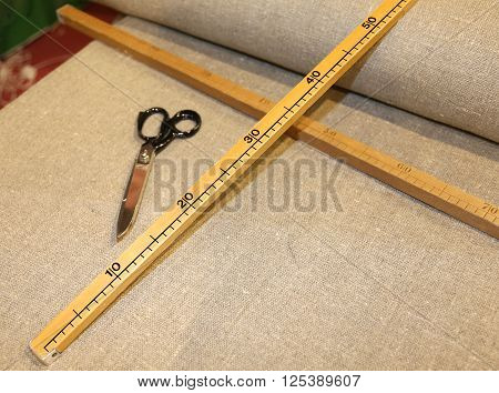Scissors And The Wooden Meter In Italian Artisan Tailoring