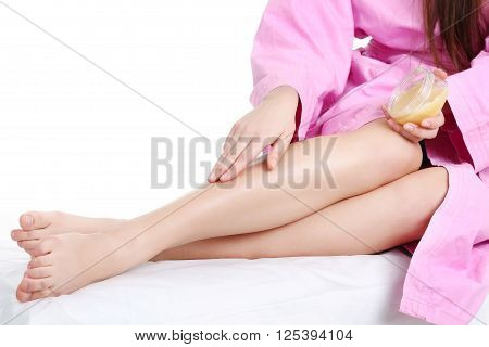 Young spa woman touching her face after beauty treatment