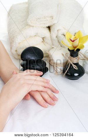 Young spa woman touching her face after beauty treatment