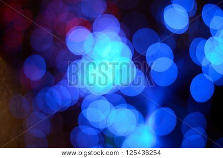 Blurred abstract pink and blue bokeh lights. Christmas holiday defocused background. Backdrop for your design