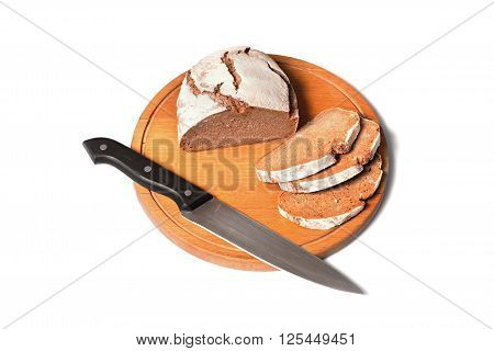 rustic bread with knife on round breadboard and all on white background