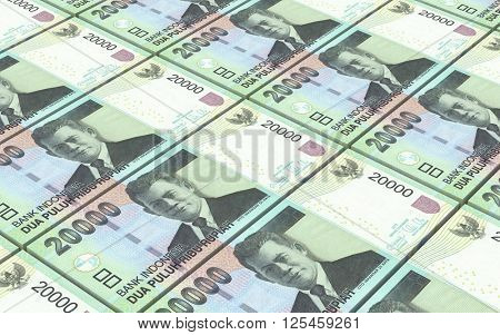 Indonesian rupiah bills stacks background. 3D illustration.