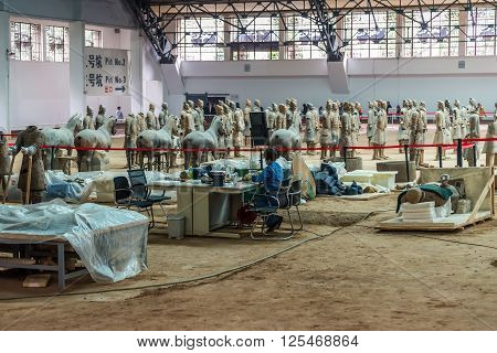 Xian China - October 16 2013: Research and restoration of the Terra-cotta Warriors near Xian in China.