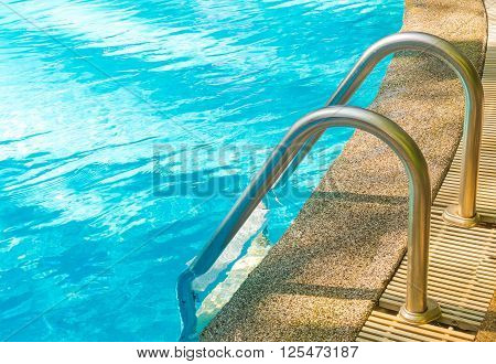 Metal stair at swimming pool for exercise and relax