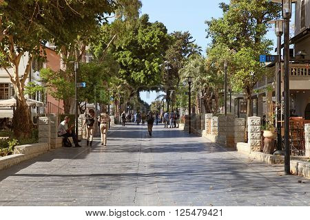TEL AVIV, ISRAEL - APRIL 7, 2016 : People in open air commercial center Sarona in Tel Aviv, Israel. Recently open Sarona Market became the most popular place in Tel Aviv.