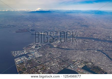 Aerial view of Tokyo Bay and Mount Fuji in Tokyo, Japan.