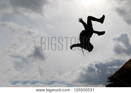 Teenage boy doing a back flip silhouetted
** Note: Visible grain at 100%, best at smaller sizes