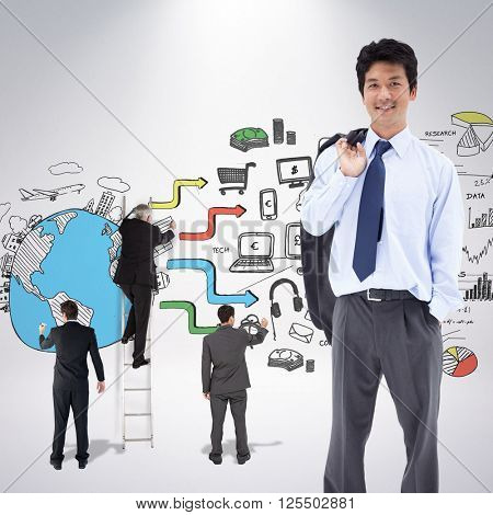 Portrait of a relaxed businessman with his jacket on his shoulder against grey background