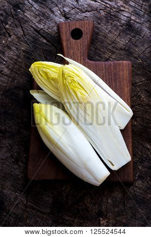 Fresh Chicory Salad  On  Rustic Wooden Table.