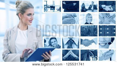 Cheerful stylish businesswoman using digital tablet against composite image of shaking hands over eye glasses and diary after business meeting