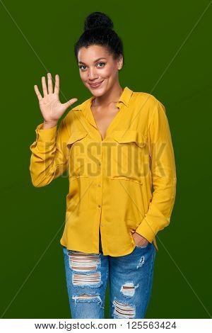 Hand counting - five fingers. Happy mixed race african american - caucasian woman showing five fingers