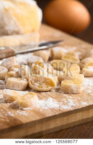 Raw homemade Hungarian Csipetke soup pasta or noodle made of flour egg and salt photographed with natural light (Selective Focus Focus one third into the image)