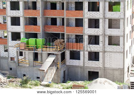 Monolithic frame construction of the building. Solid walls of concrete. Formwork for walls made of concrete. Construction of the building. Masonry walls and aerated concrete masonry walls