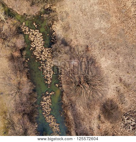 Top view of the autumn field. Top view of the vehicle in the field. View from the aerial view.