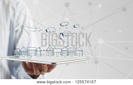 Hand of businessman demostrating tablet and construction concept on screen